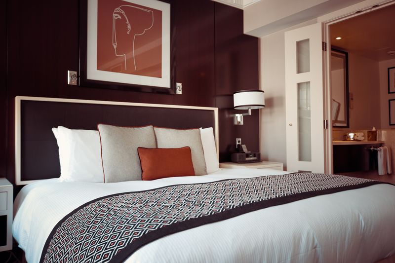 Modern hotel room with bed and artwork