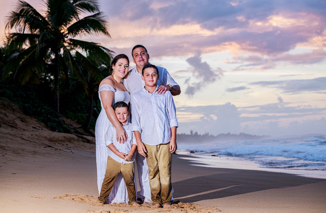 Family on a beach at sunset